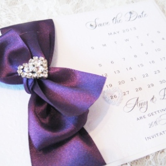 Save the date wedding cards with purple ribbon and diamante heart